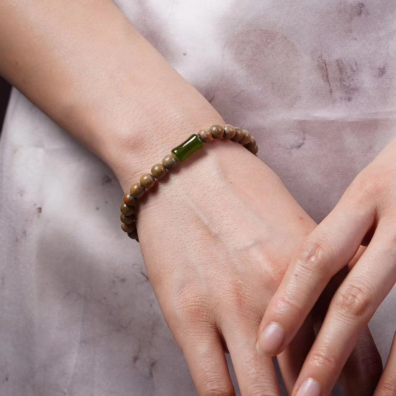 Vòng tay đàm hương mix charm bạc