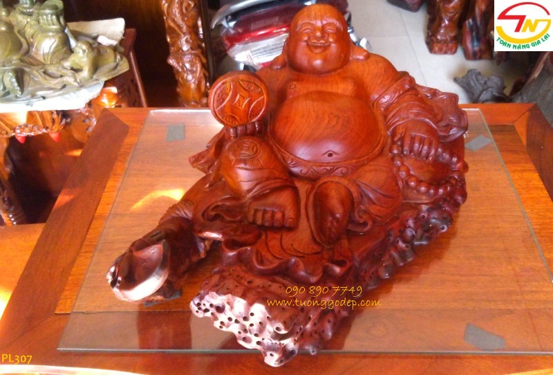 Tượng phật di lặc cầm đồng tiền