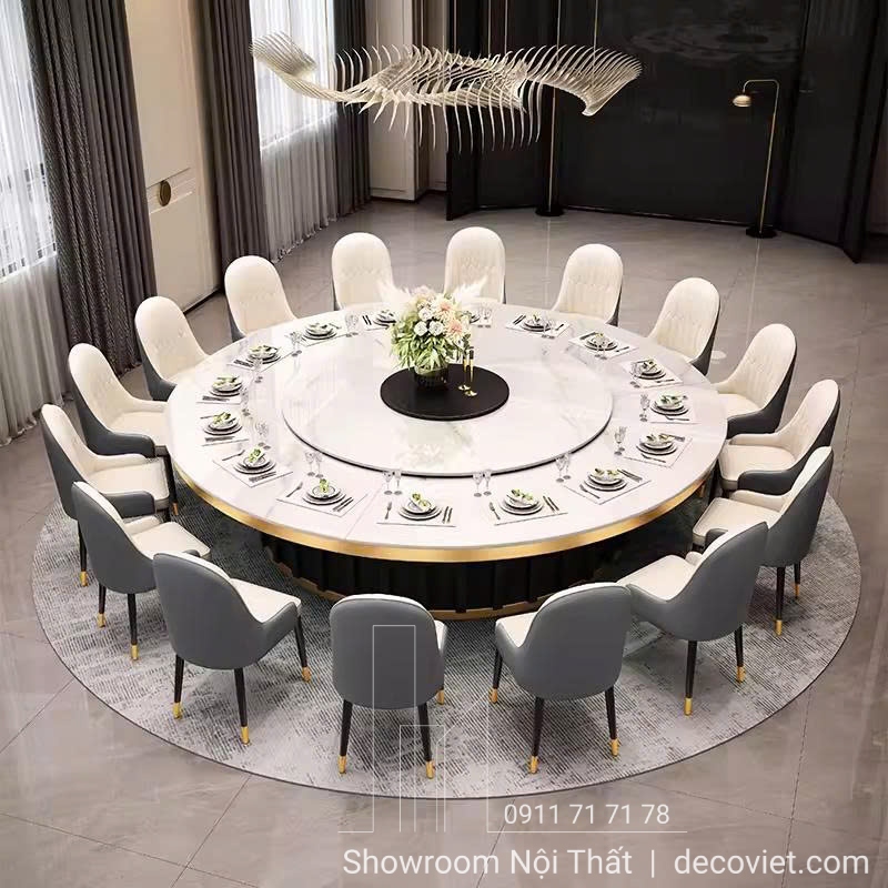 Bàn ăn tròn mặt đá lớn, kích thước tiêu chuẩn cho phòng ăn rộng.