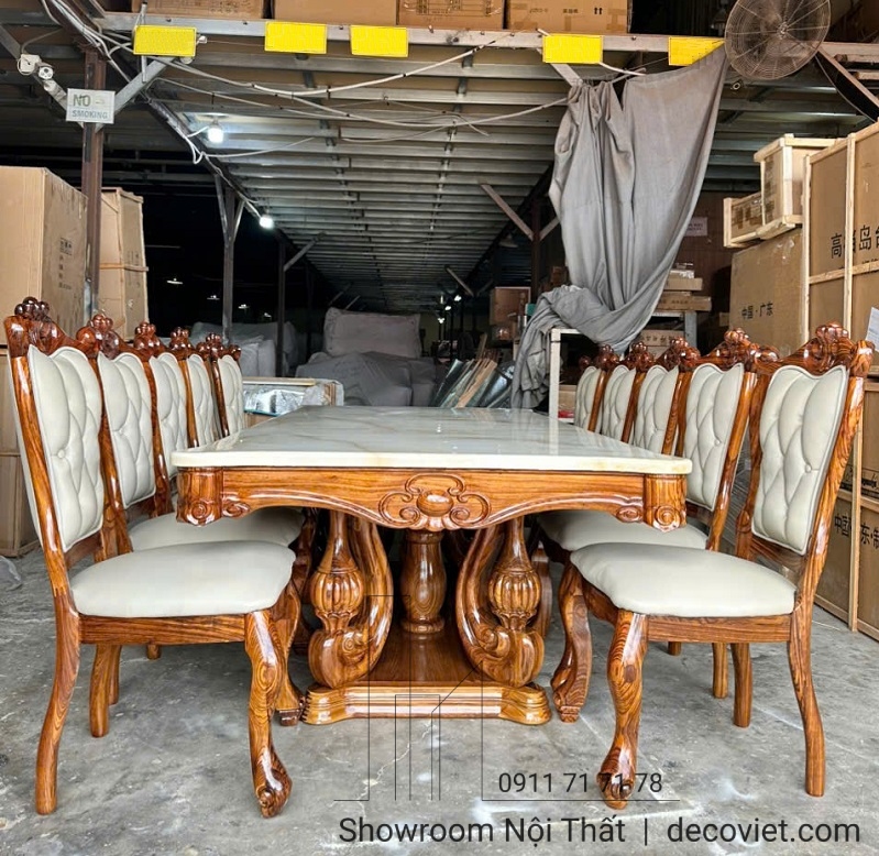 Bộ bàn ăn gỗ mun mặt đá nguyên tấm, thiết kế tân cổ điển đi kèm 10 ghế da bò tót cao cấp.