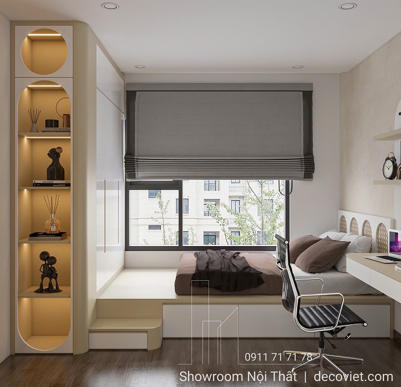 Phòng ngủ phụ tích hợp bàn học và giá sách gọn gàng cạnh cửa sổ đón nắng