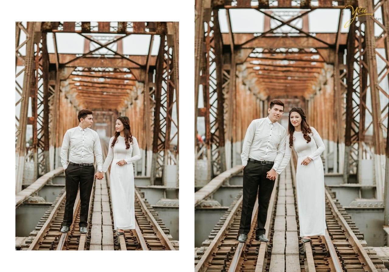 ảnh cưới pre wedding cô dâu chú rể nắm tay đi trên đường ray cầu long biên