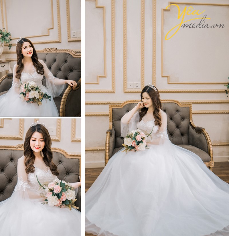 cô dâu xinh đẹp ngồi trên ghế sofa ở phim trường