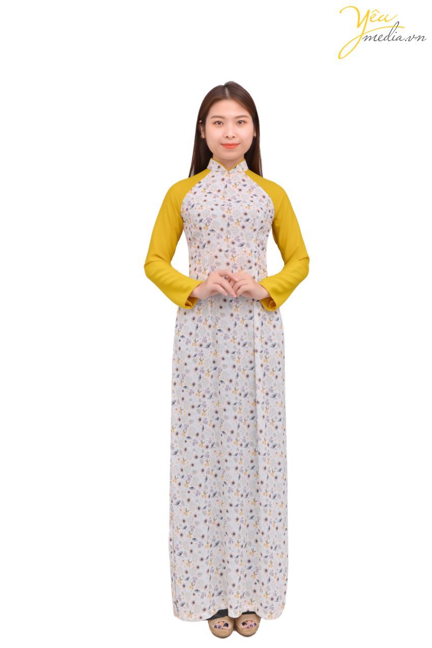 Áo dài 77 - một mẫu áo dài mới mẻ, trẻ trung của Yêu media được nhiều bạn trẻ từ 16-25 yêu thích. Mẫu áo dài tay - với phần ống tay màu vàng nổi bật, trên nền tà áo hoa xanh - vàng - trắng. Đây là mẫu áo sẽ giúp bạn tôn lên vẻ đẹp vừa nữ tính vừa hiện đại khi diện trên mình.