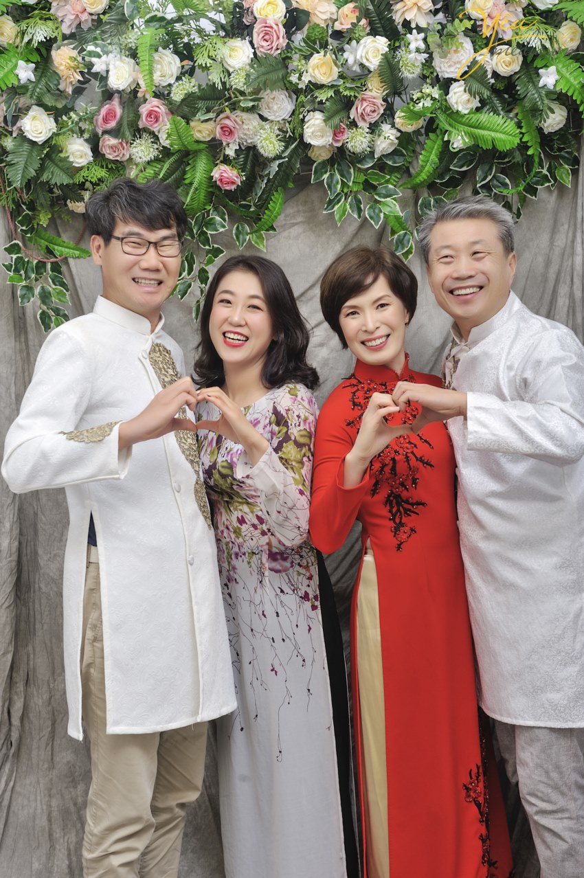korean tourist in ao dai traditional dress viet nam
