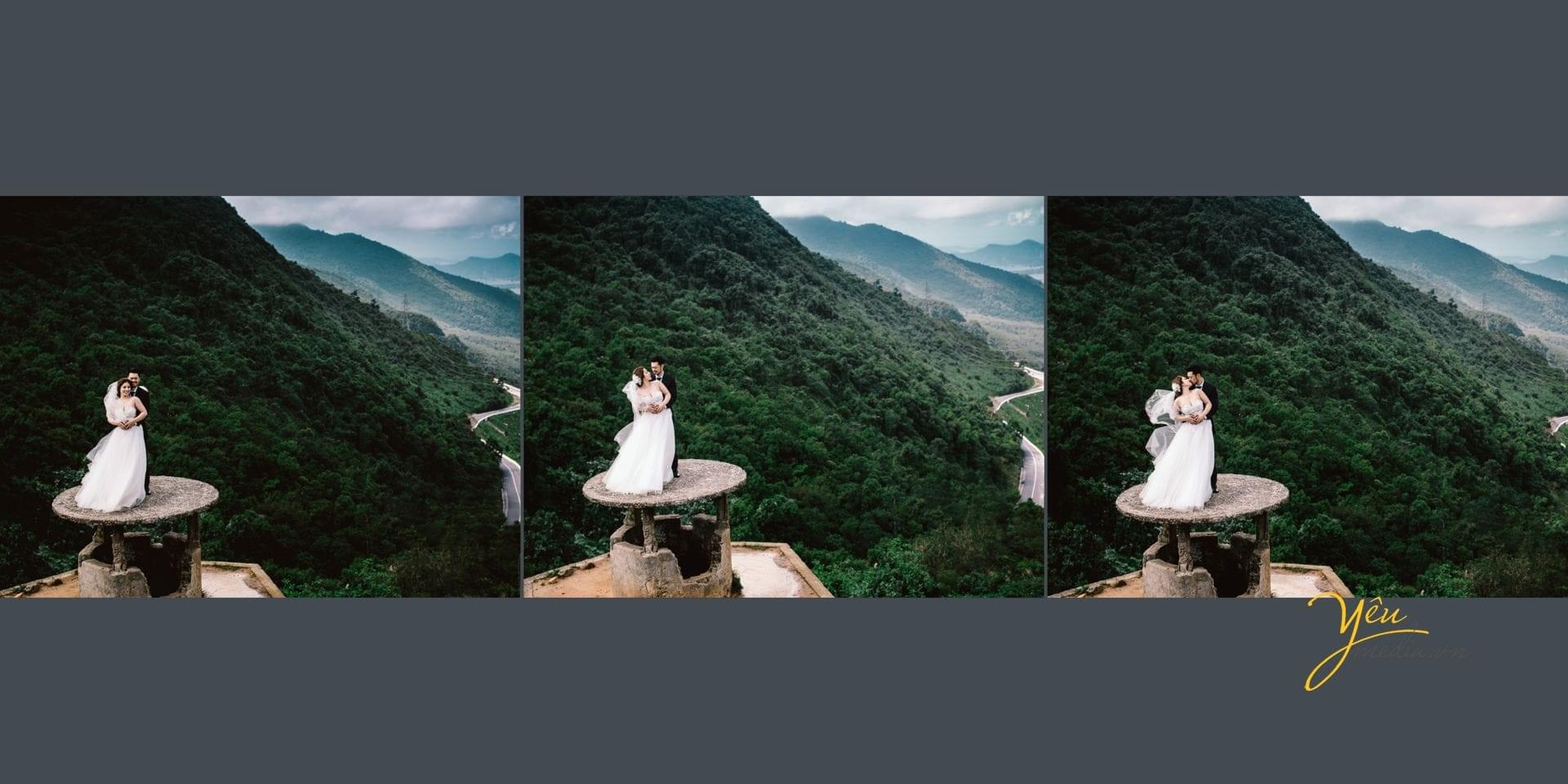 chú rể ôm phía sau lưng cô dâu trên đỉnh đèo hải vân