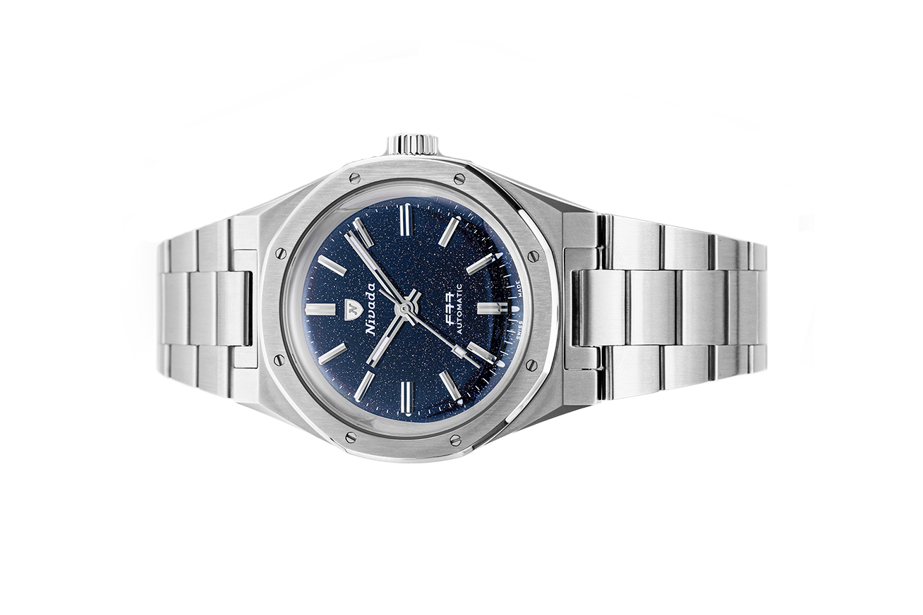 Đồng hồ đeo tay thương hiệu Nivada Grenchen, dòng sản phẩm F77, Ref number: 68010A77, mặt số đá thạch anh Aventurine xanh dương đậm size 37mm, máy tự động,dây và vỏ bằng thép không gỉ 316L,mới 100%