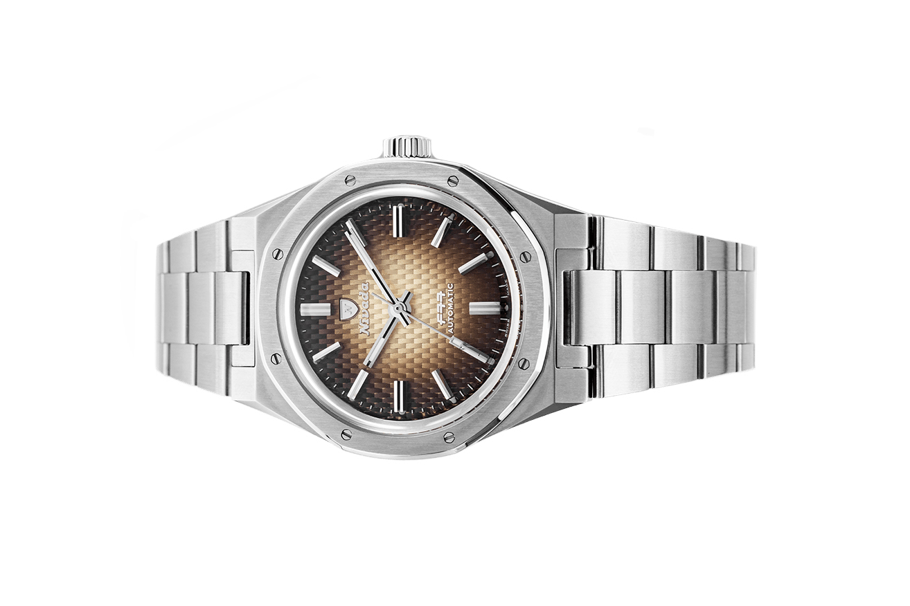 Đồng hồ đeo tay thương hiệu Nivada Grenchen, dòng sản phẩm F77, Ref number: 68002A77, mặt số màu nâu size 37mm, máy tự động,dây và vỏ bằng thép không gỉ 316L, mới 100%