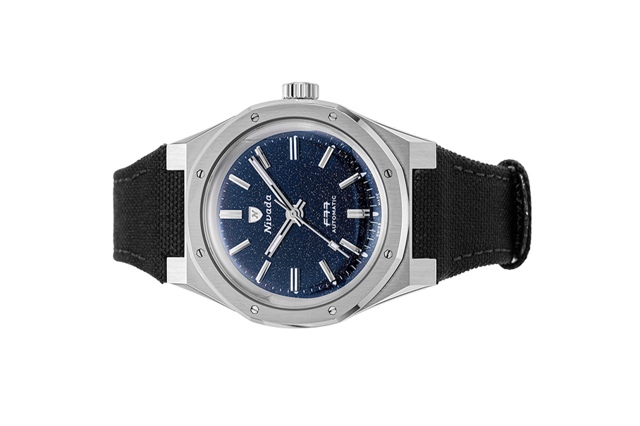 Đồng hồ đeo tay thương hiệu Nivada Grenchen, dòng sản phẩm F77, Ref number: 68010A77, mặt số đá thạch anh Aventurine xanh dương đậm size 37mm, máy tự động,vỏ bằng thép không gỉ 316L và dây vải Velcro, mới 100%