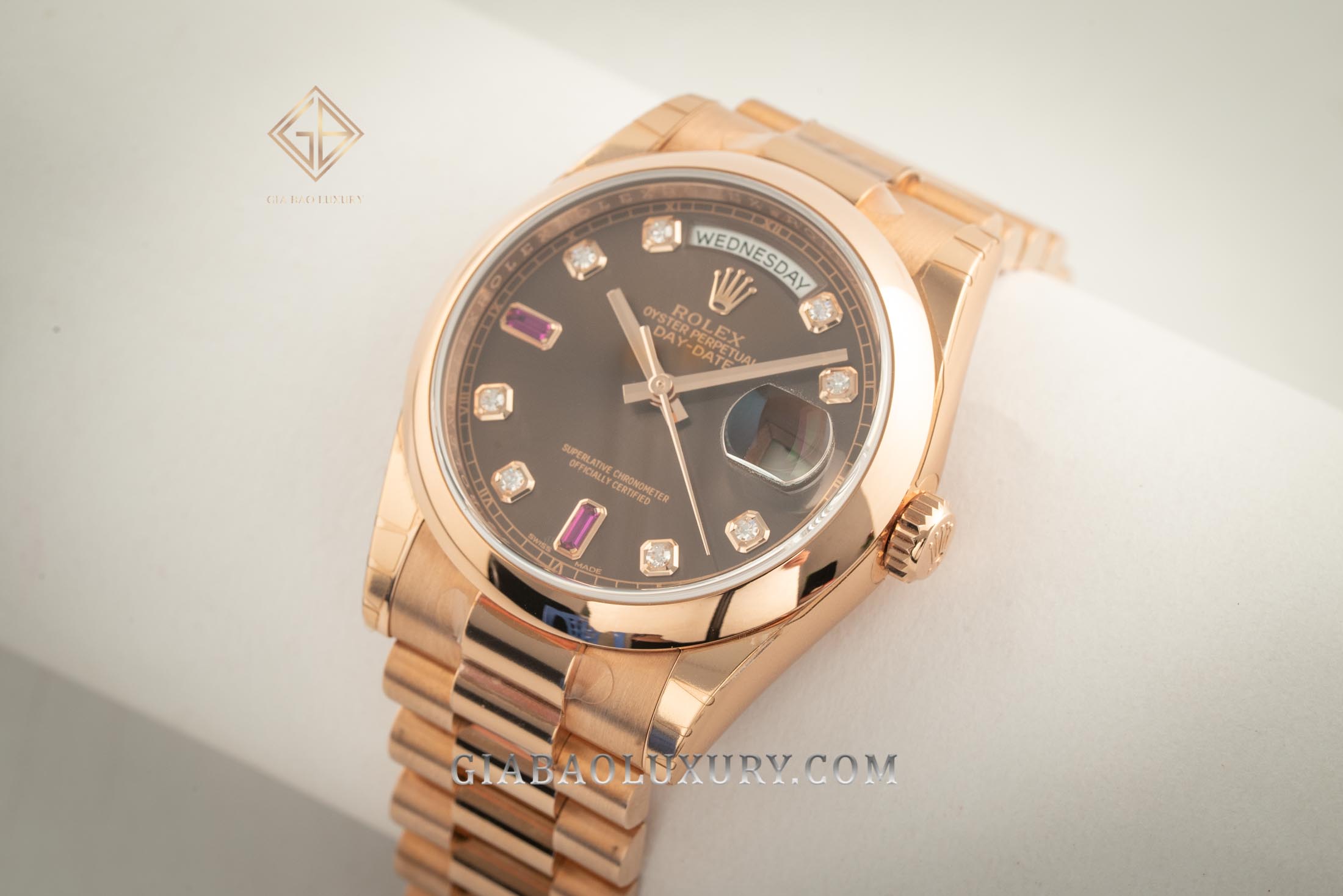 Đồng Hồ Rolex Day-Date 36 118205 Mặt Số Chocolate Nạm Đá Ruby Đỏ