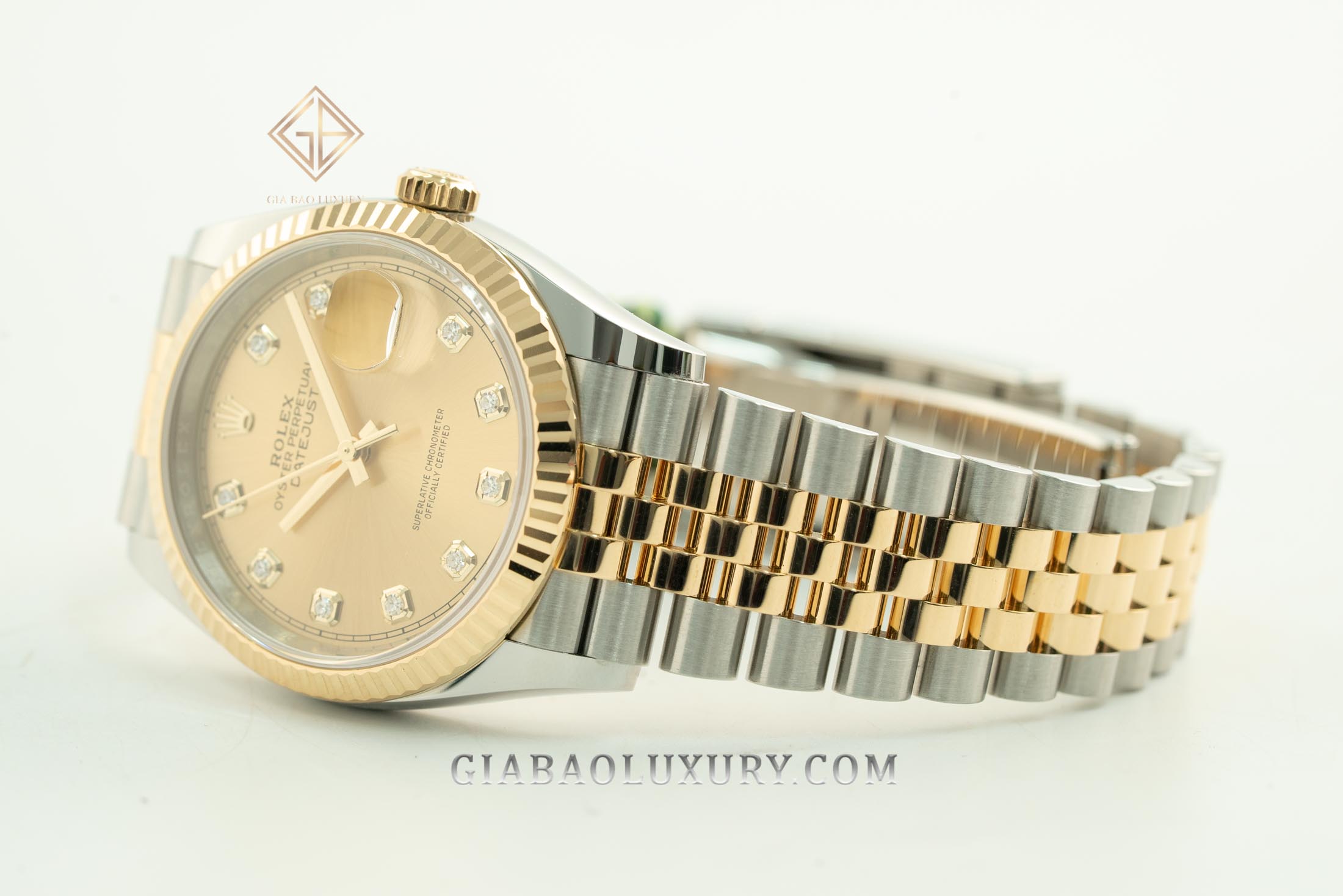 Đồng Hồ Rolex Datejust 36 126233 Mặt Số Vàng Champagne Cọc Số Nạm Kim Cương