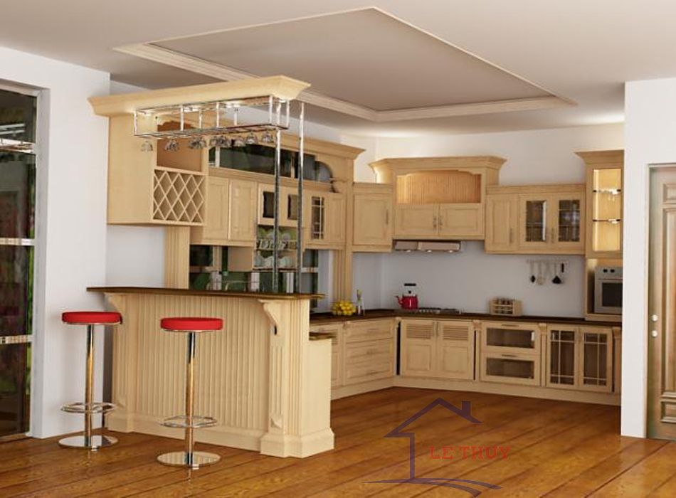 Quầy bar hiện đại được kết hợp với mẫu tủ bếp gỗ sồi tạo không gian ấm cúng cho căn nhà