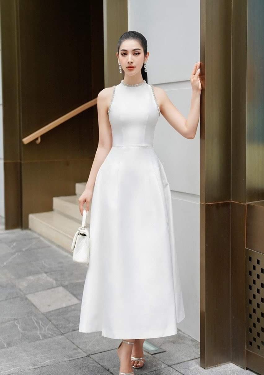 Đầm dự tiệc dáng xòe kiểu sát nách phối túi đính viền ngọc