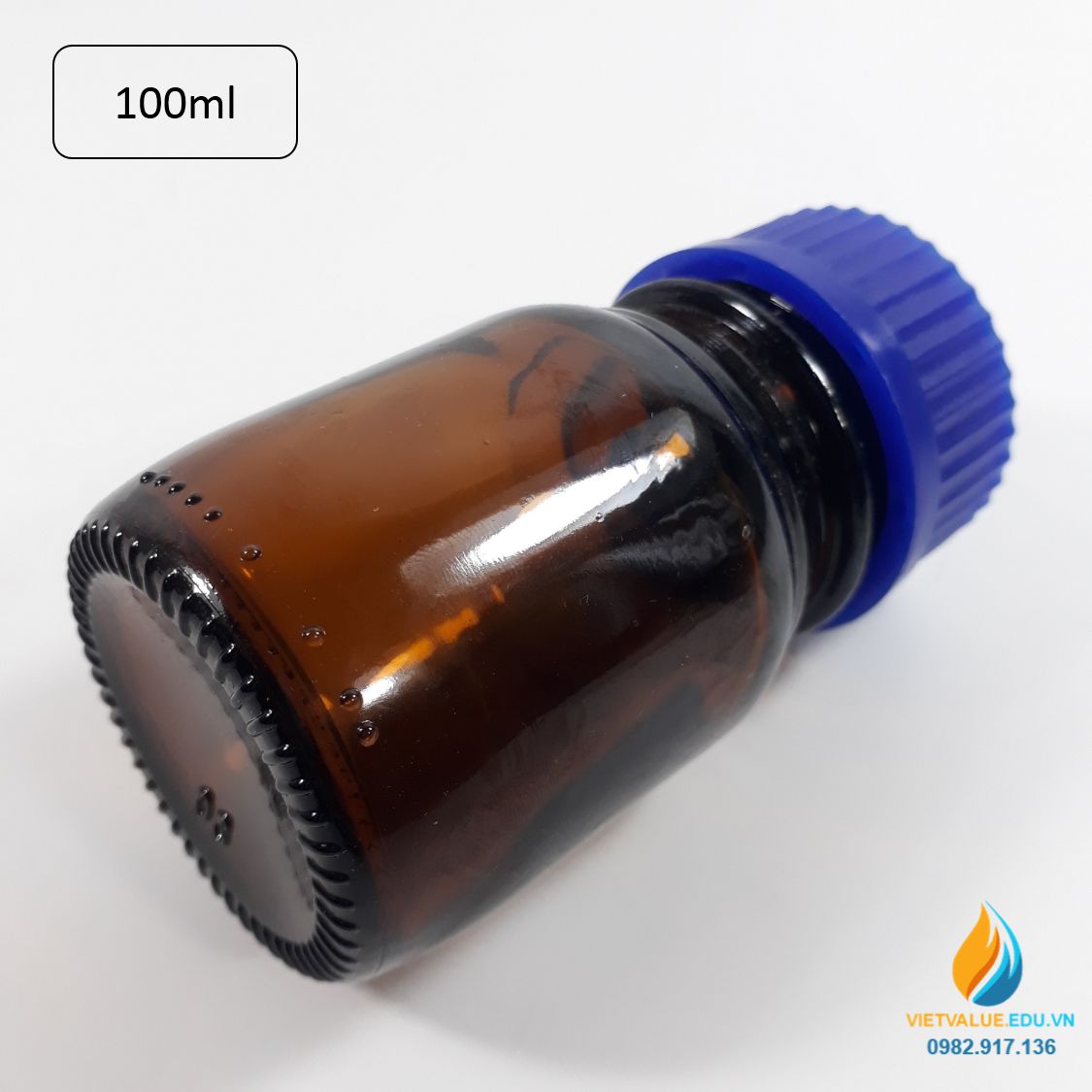 Chai trung tính 100ml màu nâu hổ phách, nắp vặn xanh, chịu nhiệt