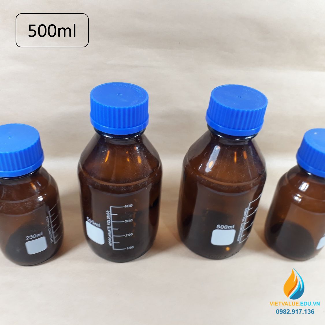 Chai trung tính 500ml màu nâu hổ phách, nắp vặn xanh, chịu nhiệt