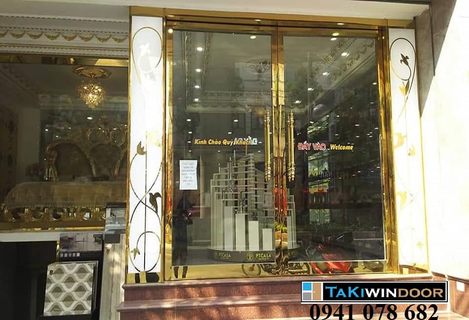 Cửa kính khung inox vàng mặt tiền shop