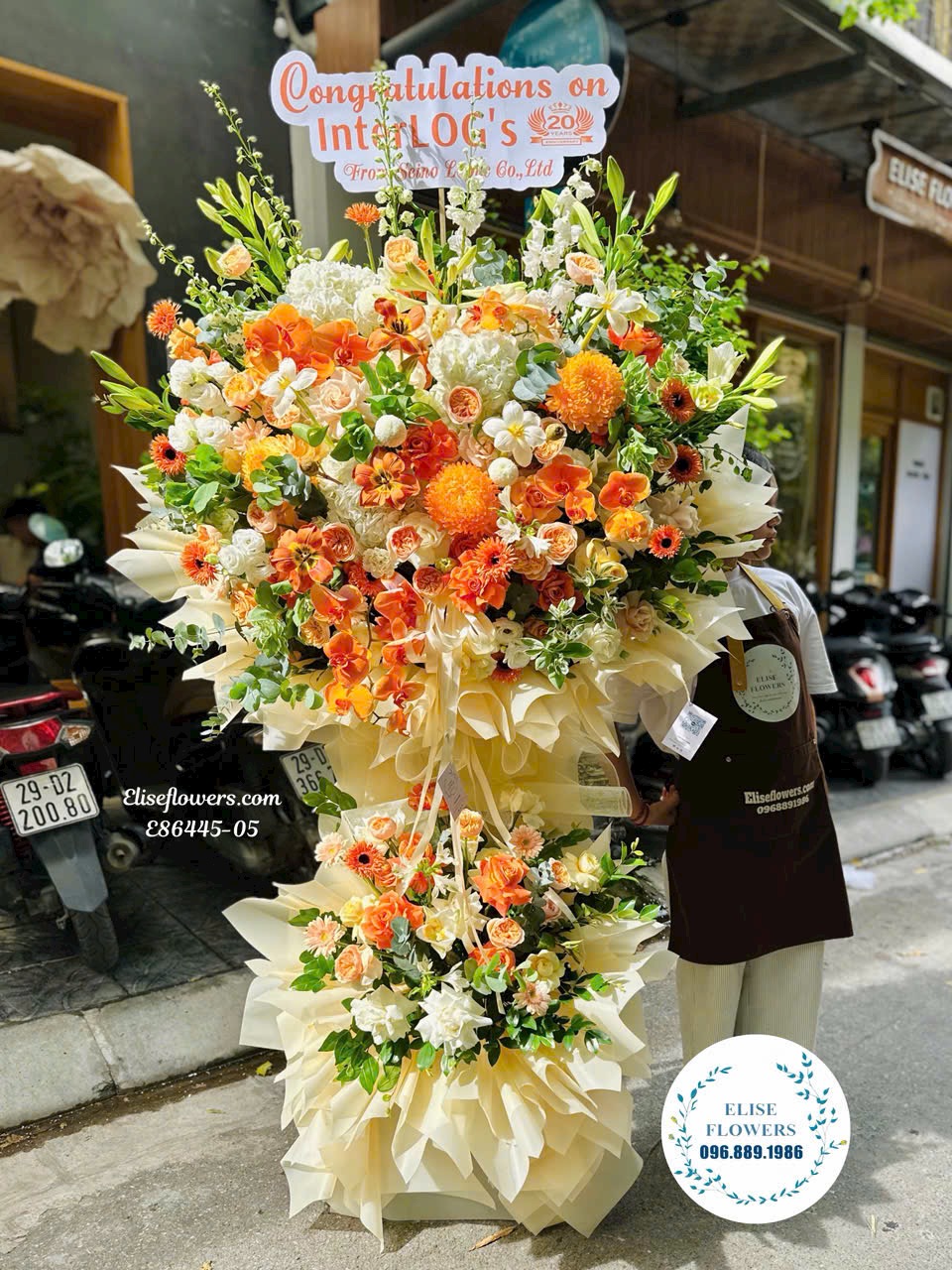 Hoa sự kiên. Kệ hoa chúc mừng tone cam ở Hà Nội. Shop hoa tươi Eliseflowers