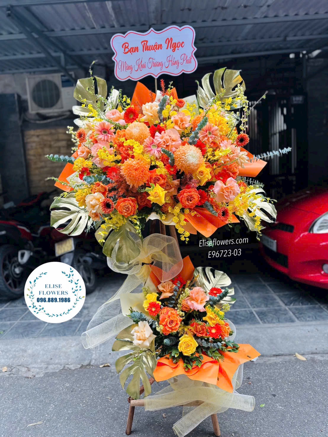 Hoa khai trương Cầu Giấy. Kệ hoa tone cam phú quý, tài lộc. Hoa chúc mừng sự kiện, thành lập công ty