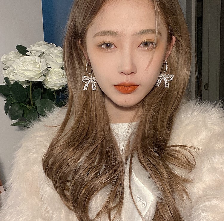 Khuyên tai nơ đính đá ngọc trai