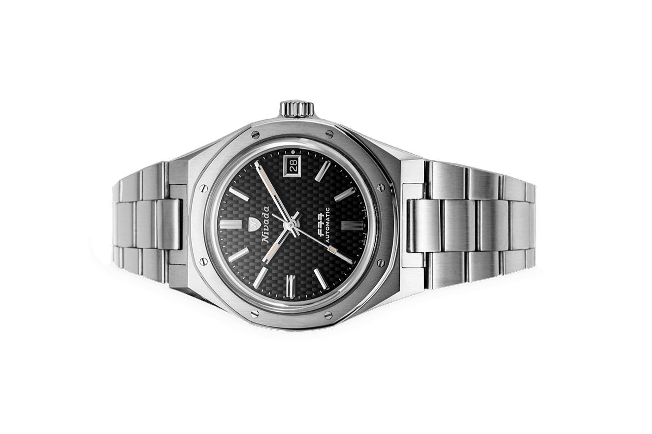 Nivada Grenchen, dòng sản phẩm F77, Ref number: 69000A77, mặt số màu đen size 37mm,máy tự động,dây và vỏ bằng thép không gỉ 316L,mới 100%