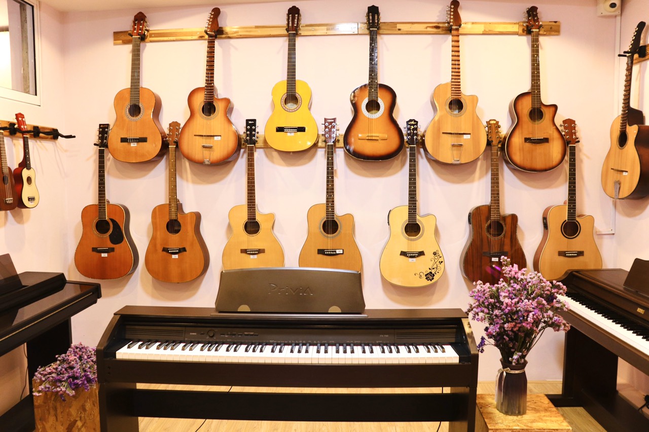 Địa điểm mua đàn guitar acoustic đen uy tín