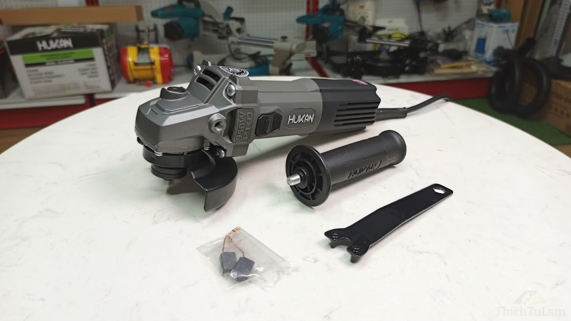 Máy mài công tắc trượt 100mm 950W Hukan HKG2-AG50950PRO