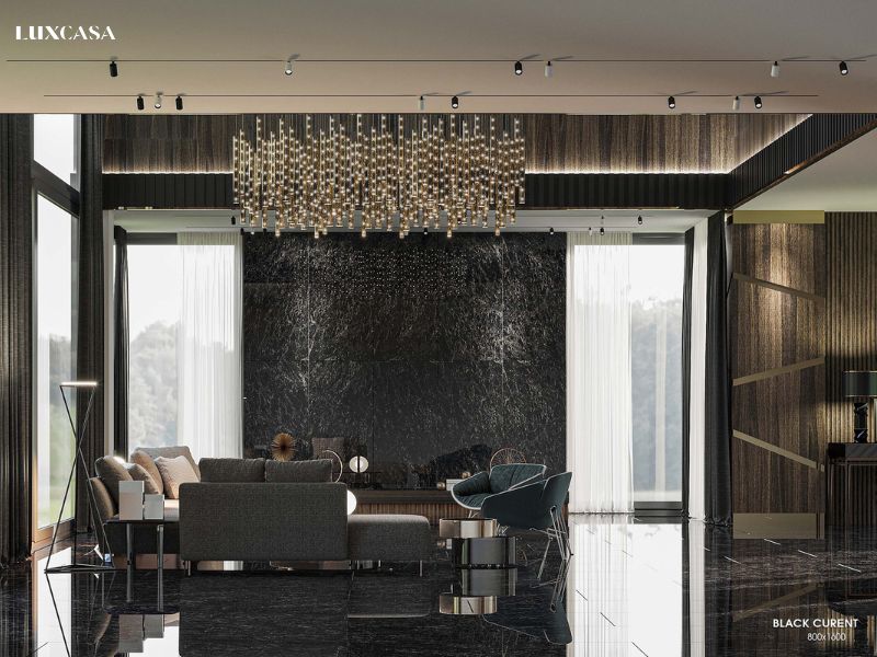 Phòng khách được lát và ốp bằng gạch màu đen giả đá mang đến sự cuốn hút