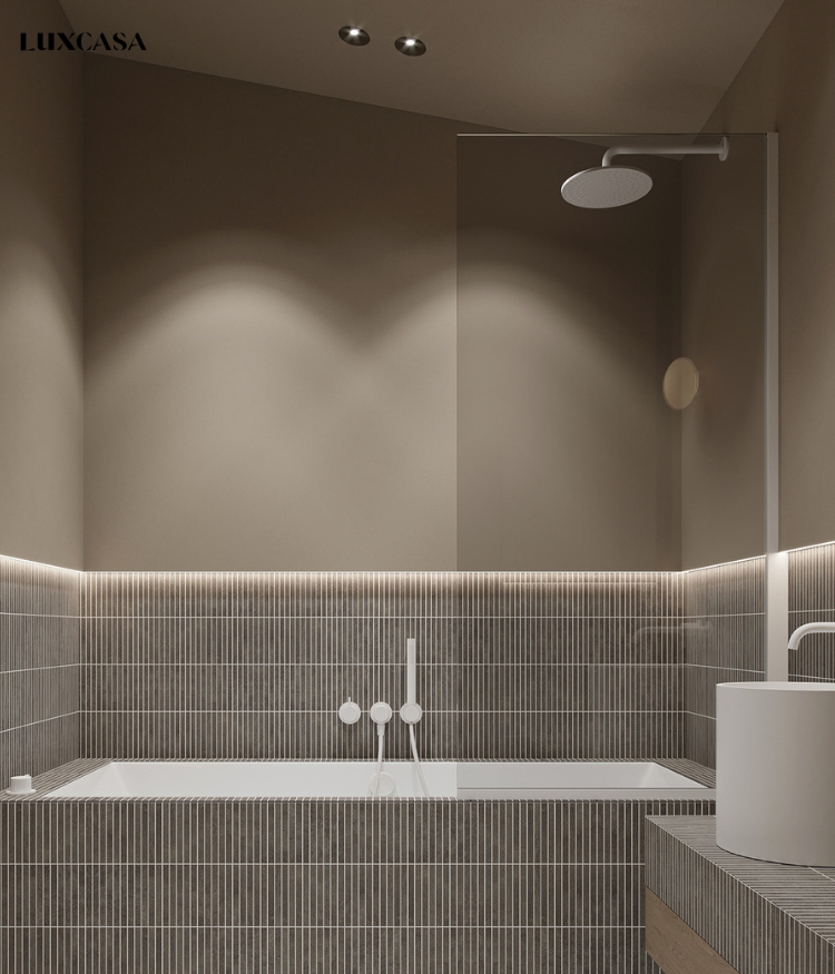 Nhà tắm với sự kết hợp của gạch thẻ mosaic màu xám bạc, ron trắng tạo nên không gian với phong cách hiện đại.