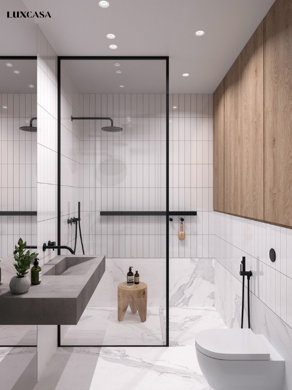 Gạch thẻ trắng ốp tường kết hợp với gạch giả đá trắng vân mây sẽ làm nổi bật thiết bị vệ sinh cao cấp trong phòng