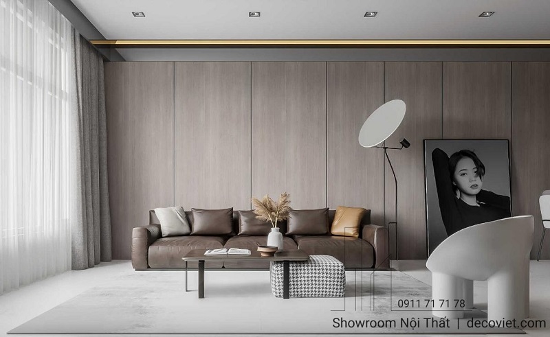Phòng khách tối giản, sang trọng với ghế sofa da nâu và decor nghệ thuật – thiết kế bởi đội ngũ nội thất Thủ Đức.