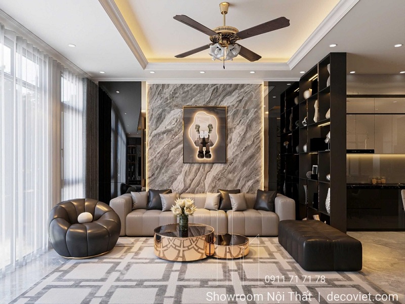 Phòng khách sang trọng với điểm nhấn tường ốp đá và sofa da cao cấp – nội thất Thủ Đức thi công hoàn thiện.