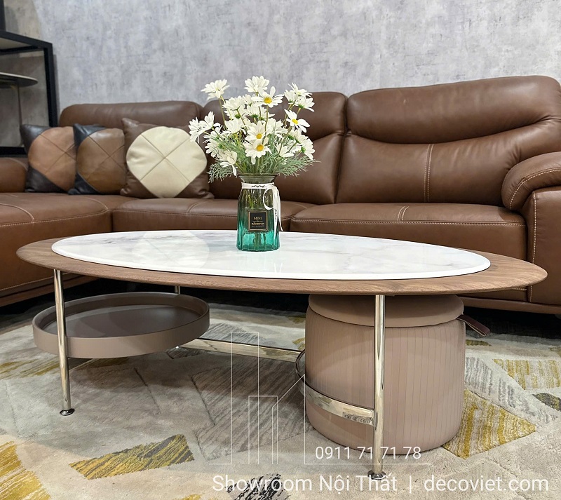 bàn sofa oval hiện đại có kệ lưu trữ tiện lợi và ghế đôn mini đi kèm