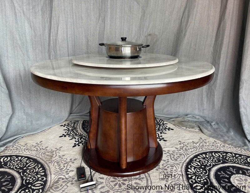 Thiết kế bàn ăn tròn mặt đá thông minh với bếp điện tích hợp sẵn