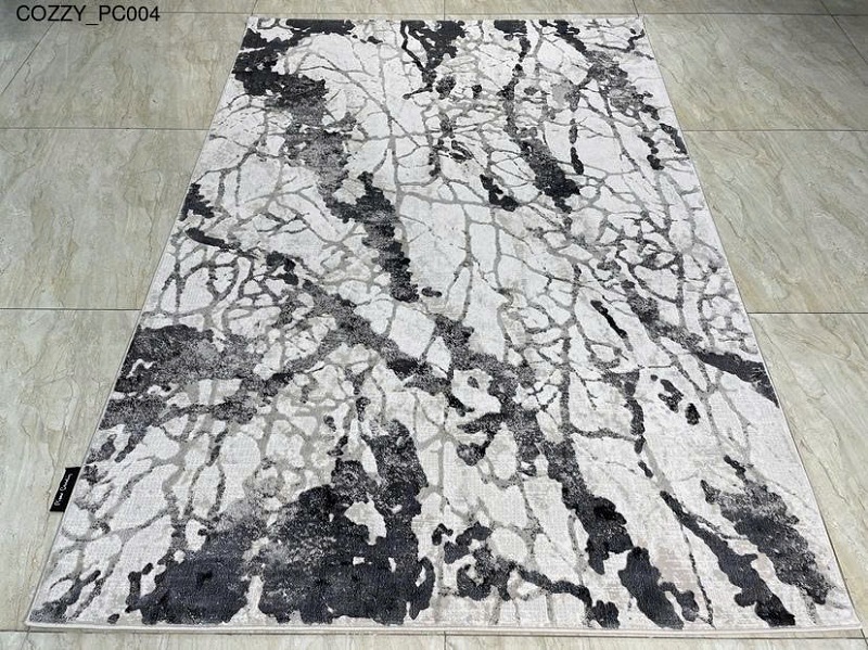 Thảm lót sàn phòng khách tông màu trung tính, phối họa tiết hiện đại sang trọng.