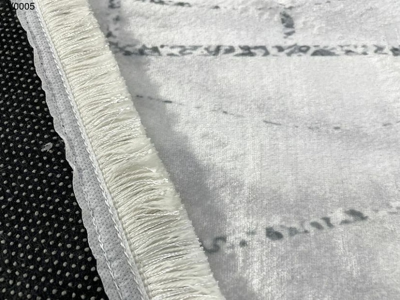 Không gian phòng khách hiện đại với thảm trải sàn và bàn trà đôi tinh tế