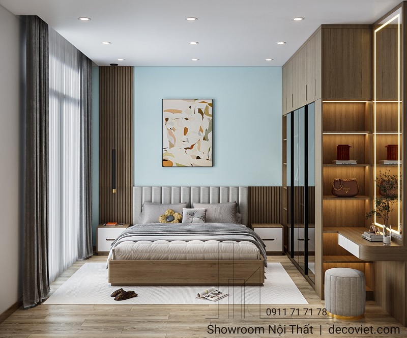 Phòng ngủ master hiện đại với góc làm việc và kệ trang trí gọn gàng, tiện nghi.