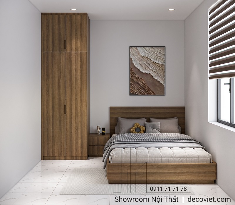 Phòng ngủ nhỏ gọn với tủ quần áo âm tường kết hợp bàn trang điểm tiện lợi.