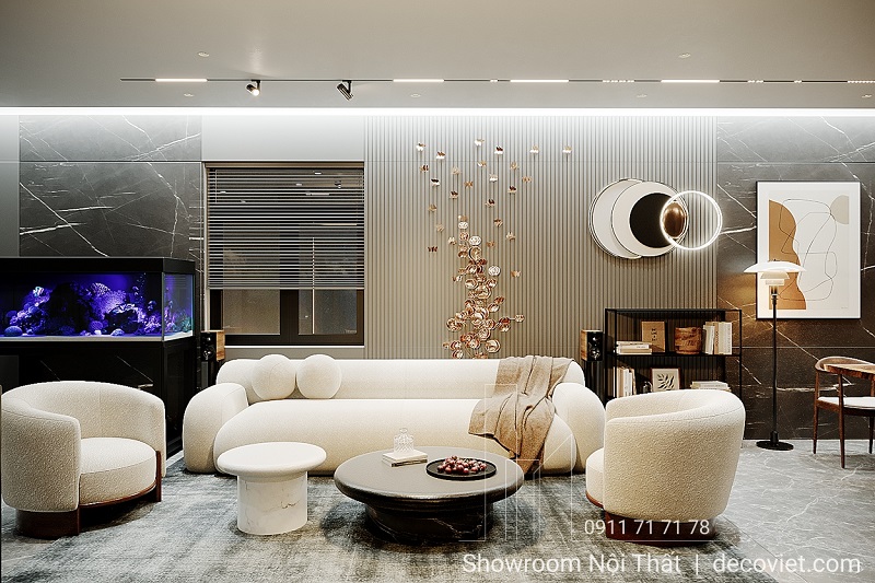 Phòng khách hiện đại với sofa trắng, bàn trà tròn và bể cá cảnh tạo điểm nhấn.