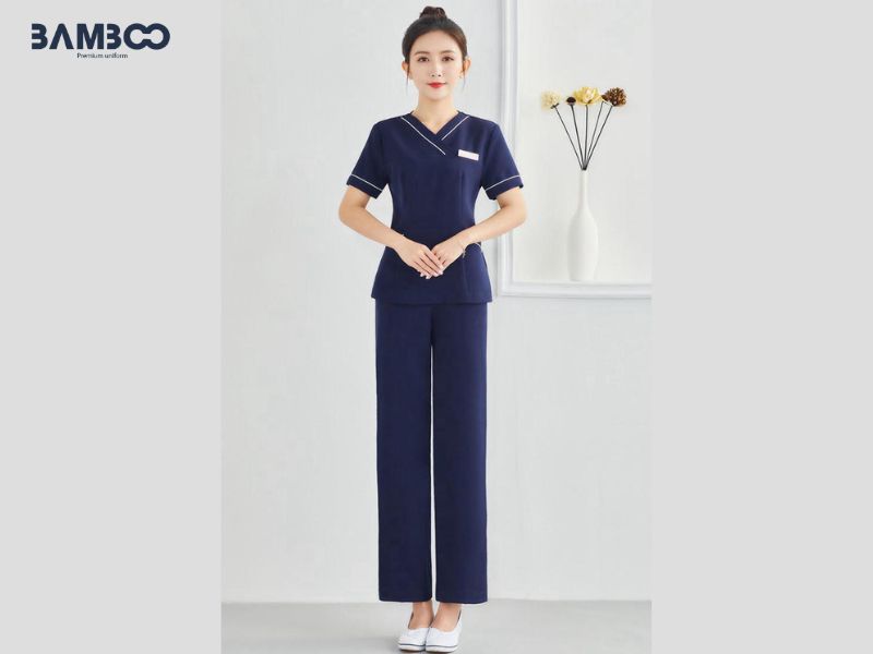 Đồng phục spa nail cổ V xanh navy viền trắng