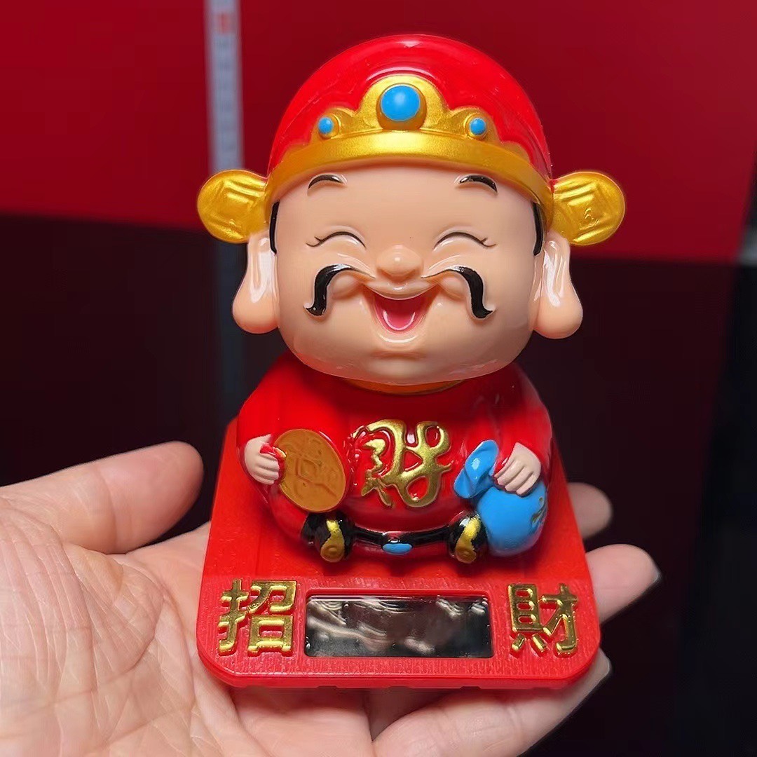 Tượng thần tài cầm ĐỒNG TIỀN tự động gật đầu chiêu tài lộc