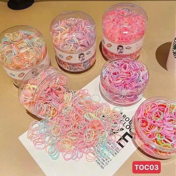 Hộp 600 dây buộc tóc 2 ngăn TRỨNG KHỦNG LONG cho bé