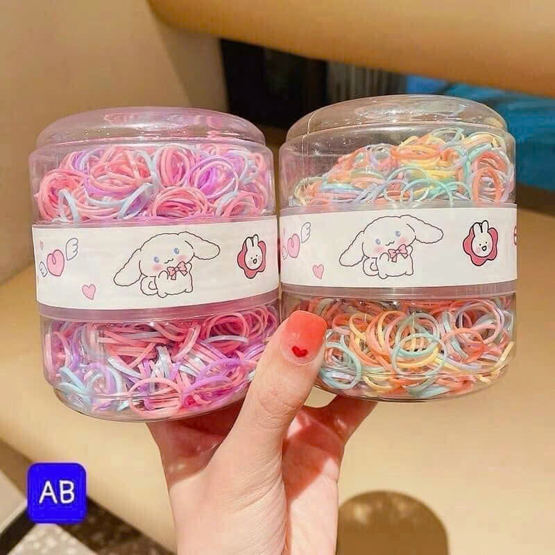 Hộp 600 dây buộc tóc 2 ngăn TRỨNG KHỦNG LONG cho bé