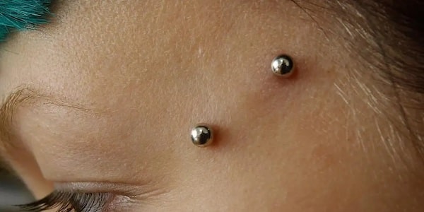 Dấu hiệu nhận biết lỗ xỏ khuyên bị đào thải