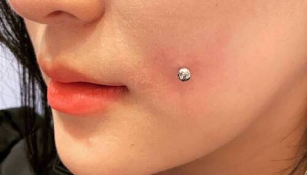 Xỏ khuyên má lúm bao lâu thì khỏi?