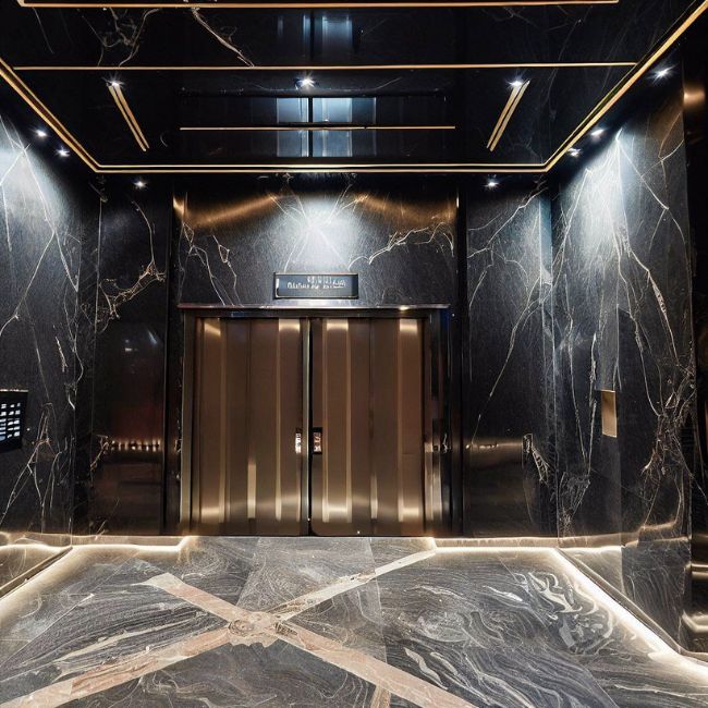 Cửa thang máy được ốp bằng đá granite đen