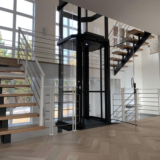 Mẫu thiết kế  thang máy đẹp và hiện đại với cabin kính trong suốt