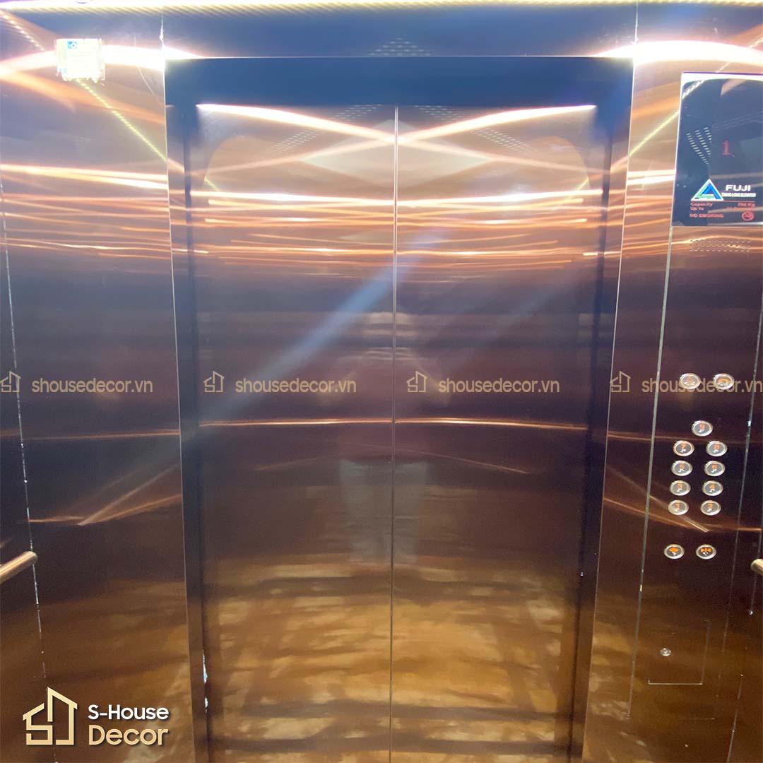 Ốp inox cabin thang máy màu đồng đỏ dự án Paris Club S-House Decor
