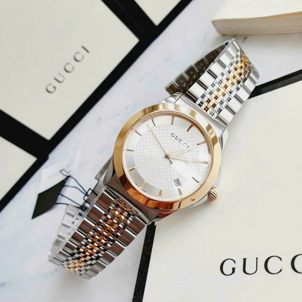 Đồng Hồ Gucci G-Timeless |Cặp Đôi |Mặt Màu Trắng |Dây Kim Loại Demi Vàng Gold |Size 38x28mm |donghogiatot.vn