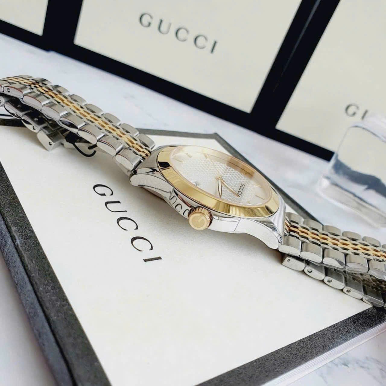 Đồng Hồ Gucci G-Timeless |Cặp Đôi |Mặt Màu Trắng |Dây Kim Loại Demi Vàng Gold |Size 38x28mm |donghogiatot.vn