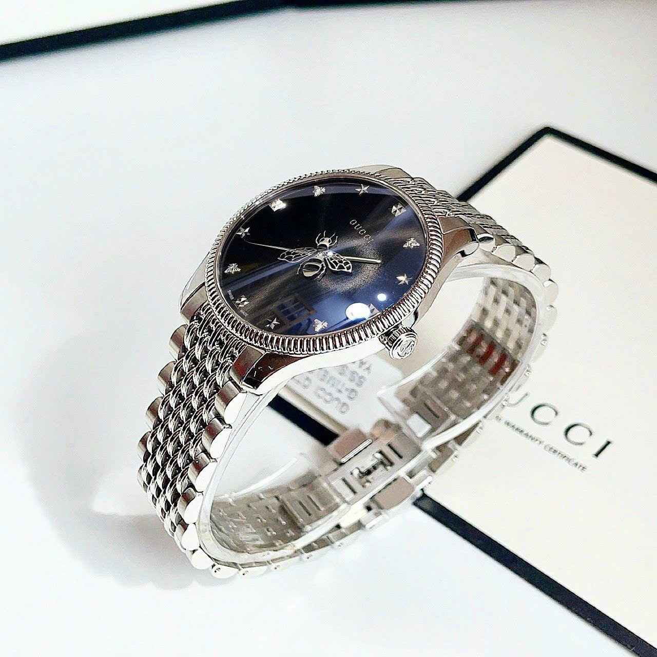 Đồng Hồ Gucci G-Timeless |Nữ Giới |Mặt Tròn Đen |Dây Kim Loại Silver |Máy Pin (Quartz) |Size 36mm |donghogiatot.vn